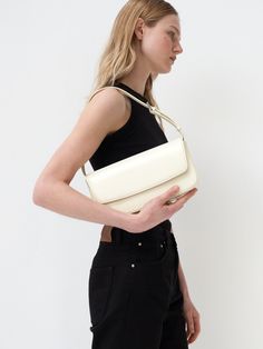 Editor's NotesHERVE's bag is classic and perfect for daily wear.- Light-weighted shoulder bag- Eye-catching flap magnetic closure detail- Adjustable strap in 6 steps- Inner open pocket- Feminine and minimal styleMeasurements(in.)- Size: 10.4in. (W) / 5.7in. (L) / 2.0in. (D)Composition & Care- Italian cow leather- Avoid direct heat and moisture- Professional cleaning is recommendedDesigner- by HERVE Everyday Classic Box Bag With Detachable Strap, Classic Everyday Box Bag With Detachable Strap, Classic Shoulder Baguette Bag, Classic Baguette Shoulder Bag, Classic Satchel Baguette Bag With Single Shoulder Strap, Classic Formal Bag With Single Shoulder Strap, Classic Crossbody Baguette Bag For Daily Use, Classic Crossbody Baguette Bag With Removable Pouch, Classic Crossbody Shoulder Bag With Single Strap