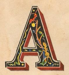 the letter a is decorated with flowers and leaves