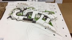 a model of a city with buildings and trees