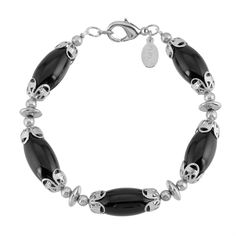 A classic designed bracelet featuring genuine gemstones available in rose quartz and black onyx, capped with filigree designs. This necklace comes with a 1928 logo tag with a lobster clasp closure for a secure fit. Available in Rose Quartz And Black Onyx Gemstones Measurements: 7.5"L x 0.4"W Made In USA 1928 JEWELRY COLLECTION From the vaults of rich European capitals to the antique laden attics of old American estates, 1928 Jewelry has created modern replicas of the most beautiful, exquisite vi Channel Jewelry, 1928 Jewelry, Vintage Inspired Jewelry, Bracelet Online, Gemstone Beaded Bracelets, Semi Precious Stone, Stone Bracelet, Bead Bracelet, Semi Precious Gemstones