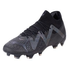 the new balance football shoe is black and silver