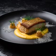 a piece of fish on a plate with mustard sauce