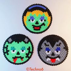 three round beaded coasters with faces on them