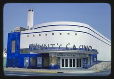 an old movie theater with blue and white paint