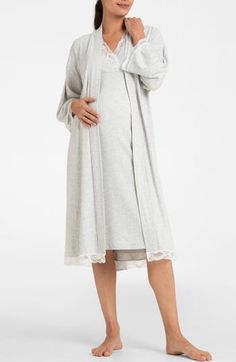 Feel the luxury of this bump-cradling robe designed with a tie belt and lacy trim. V-neck Long sleeves Removable tie belt 47% viscose, 45% cotton, 8% elastane Machine wash, line dry Imported V-neck Lace Trim Robe For Daywear, Fitted Robe With Lace Trim For Loungewear, V-neck Robe With Lace Trim For Daywear, Lace Trim V-neck Robe For Daywear, Elegant Sleepwear With Tie Waist, Elegant Spring Robe For Bedtime, Elegant Spring Bedtime Robe, Fitted Lace Robe For Loungewear, Maternity Gown