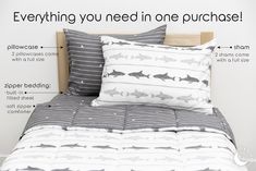 a bed with two pillows and one pillow that has sharks on it, along with the words everything you need in one purchase