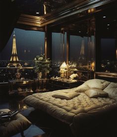 a bedroom with a view of the eiffel tower in paris, france at night