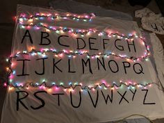 the letters and numbers are decorated with christmas lights