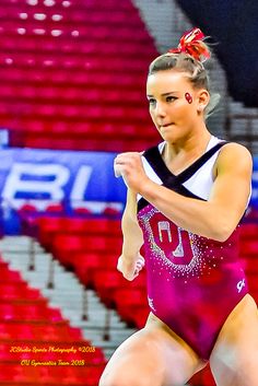 a woman in a pink leotard is dancing