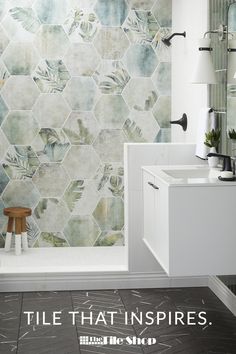 a bathroom with hexagonal tiles on the wall