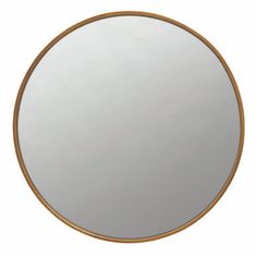 a round mirror with gold trim around the edges