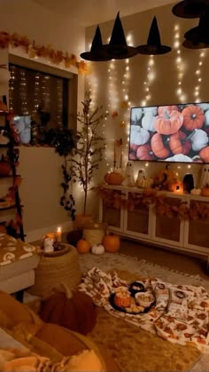 a living room filled with lots of furniture and decorations on the wall above it is a flat screen tv