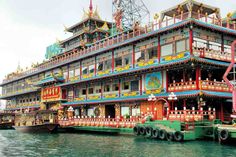 an elaborately decorated boat is docked in the water