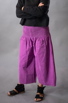 NOTE: If we're out of stock in your size, please just message us and we'll make it for you. This generally takes less than five days. The designer, Jacqueline, sews this garment by hand in her studio in San Francisco. Limited availability.  The "Jackie" Pant has a casual cut and has been designed to be comfortable yet flattering on many different body types and ages. The leg is wide with a curved, tapered hem. The waistband fits snugly around the high hip without pinching, and its stretch range accommodates a fluctuating waist size. For example, if you have a 32" waist (generic size medium) and you gain or loose weight (or get pregnant you will still be able to wear the Jackie Pant size M/L because the shirred waistband will grow and shrink with you while not looking too big or too small ( Comfort Clothing, Pink Corduroy, Travel Pants, Pull On Pants, Waist Size, Ankle Length, Body Types, Favorite Outfit, San Francisco