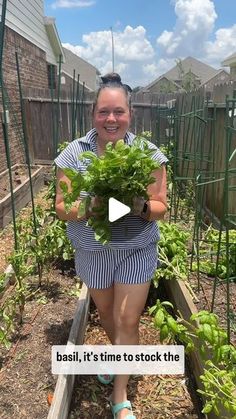 a woman holding a potted plant in her hands with the caption basil it's time to stock the garden