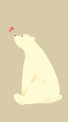 a polar bear with a red leaf in its mouth sitting down and looking up at the sky