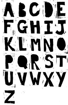 the letters are black and white with some type of paint on it's surface