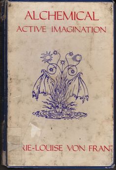 an old book with blue ink on the cover and red lettering that reads alchemical active magnation