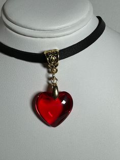 Red glass heart pendant, choker, clavicle,  minimalistic red glass heart, Y2k necklace, love necklace pendant width 13/16 inches / 2 cm pendant height 13/16 inches / 2 cm faux leather choker, clavicle band cord 35 - 42 cm / 13 3/4 - 16.5 inches long This item is shipped with a gift bag item makes such a unique gift, for friends and loved ones, for birthdays, valentines, Easter, any occasion Please have a look at the other items in my store. https://floralnaturedesigns.etsy.com I ship all multi-i Red Glass Heart Necklace, Red Heart Choker, Grunge Necklace, Y2k Necklace, Necklace Love, Pendant Choker, Heart Choker, Leather Chokers, Glass Heart