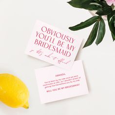 two cards that say you'll be my bridesmaid next to a lemon