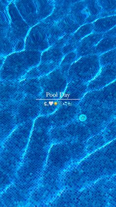 a pool with blue water and the words pool day written on it's side