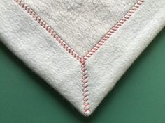 a close up of a piece of cloth with stitching on the bottom and side