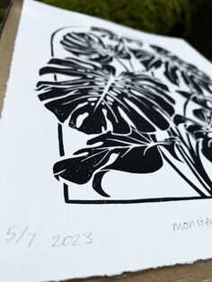 a close up of a flower on a piece of paper