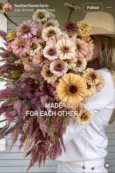 a woman holding a bouquet of flowers in front of her face with the caption made for each other