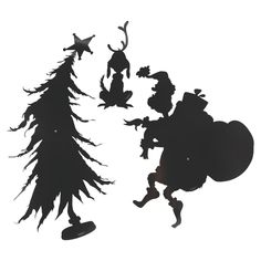 the silhouettes of two people and a christmas tree