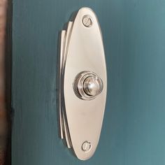 a close up of a door handle on a blue door