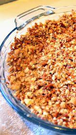 a glass bowl filled with nuts on top of a table