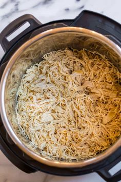 shredded noodles in an instant pot on the stove