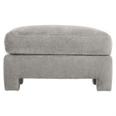 the footstool is made out of grey fabric