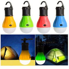 four different colored lights that are on top of each other in front of the tent