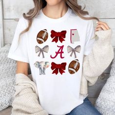 a woman sitting on a couch wearing a white shirt with red bows and footballs