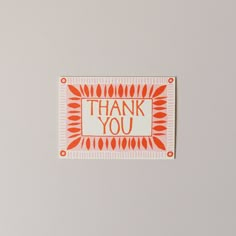 an orange and white thank you card with the words thank you written in bold font