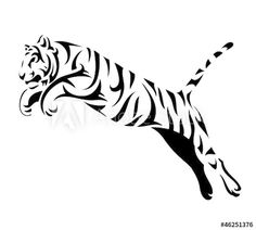 a tiger jumping in the air with its tail spread out and it's head turned to