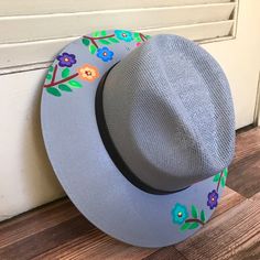 Stay stylish in this beautiful colorful hand painted straw hat, ideal for any sunny day occasion. Every single hat is hand painted uniquely which means there will never be another one like it. MADE IN MEXICO By: Mexican Artisans For: Women Size: Medium (23") Color: gray | multi Details: Material: Palm Straw Leather Band Inner elastic band Contact us for more details PLEASE READ BEFORE PURCHASE: Each product is handmade from Mexico causing differentiation and minor imperfections in each piece mak Adjustable Artisan Sun Hat For Spring, Handmade Multicolor Fedora For Spring, Artisan Handmade Sun Hat For Spring, Handmade Artisan Sun Hat For Spring, Hand Painted Brimmed Sun Hat For Spring, Hand Painted Sun Hat With Curved Brim For Spring, Handmade Multicolor Panama Hat For Spring, Hand Painted Curved Brim Sun Hat For Spring, Artistic Fedora Sun Hat For Spring