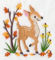 an embroidered deer with flowers and leaves on it's back is standing next to a tree