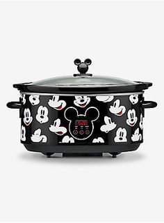 the mickey mouse slow cooker has been painted black and white with red ears on it