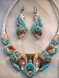 a necklace and earring set with turquoise beads