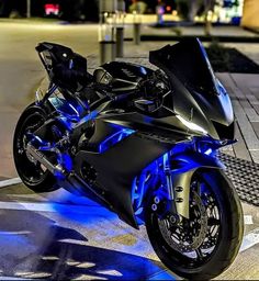 a black motorcycle with blue lights on it