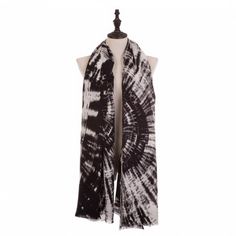 a black and white tie - dye scarf on a mannequin headdress