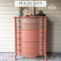 an old dresser painted in peachy keen