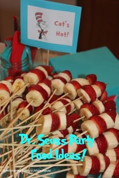 strawberries and bananas are arranged on skewers for dr seuss party food