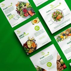 six different brochures on a green surface with food items in the middle and below them