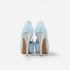 Lady Bella is a pair of custom made shoes in sweet baby blue satin. This pair of wedding heels features silky satin fabric with ivory white lace overlay. The front of this bridal heel features a dainty bow and the 4.5 inch heel of this bridal shoe is finished in silver glitter fabric. This pair of shoes is made using satin, glitter, lace, PU and other synthetic materials. They can be customized in different heel heights, colors and styles. They come with 0.5 inch elevated platform front. CUSTOMI High Heel Satin Wedding Shoes, Satin High Heel Wedding Shoes, Fitted Satin High Heel Wedding Shoes, Fitted High Heel Wedding Shoes For Ceremony, Light Blue Round Toe Evening Wedding Shoes, Elegant Light Blue Wedding Shoes For Formal Occasion, Light Blue High Heel Wedding Heels, Fitted Blue Wedding Shoes, Light Blue High Heels For Wedding