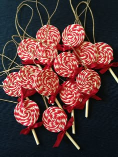 red and white lollipops are arranged on top of each other