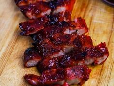 the meat is cut up and ready to be eaten on the cutting board for consumption