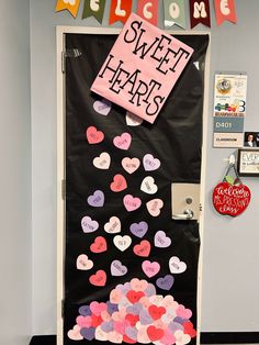 a door decorated with hearts and a sign that says welcome to sweet heart's